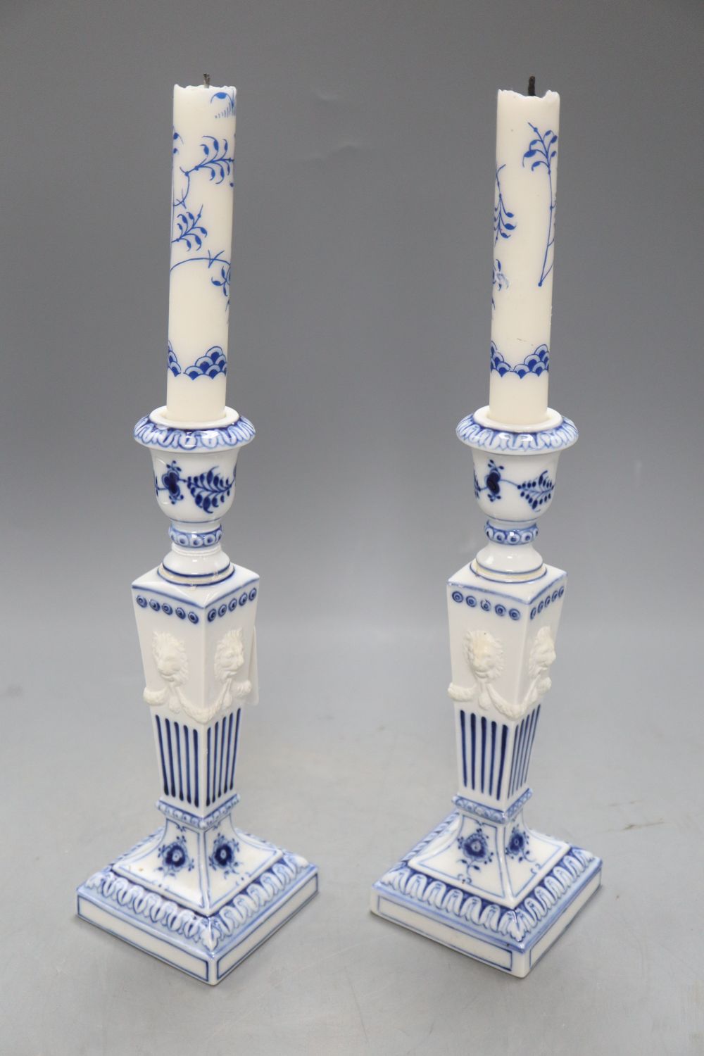 A pair of Royal Copenhagen blue and white candlesticks, height 23cm